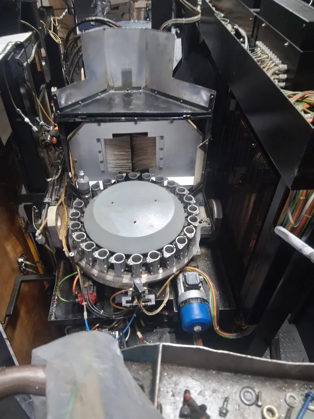 CNC tool changer assembly — close-up before dry-ice blasting